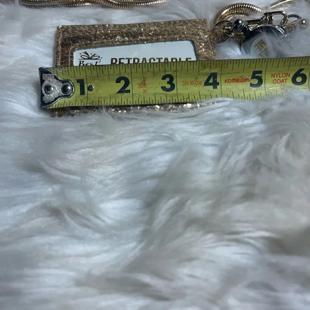 Retractable ID holder gold glitter with detachable gold tone chain .